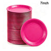 A stack of pink disposable paper plates, including one plate lying flat, is shown.
