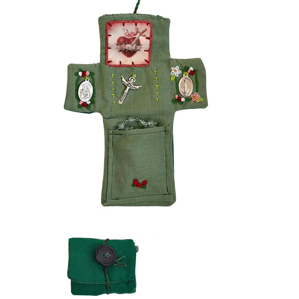 Handmade prayer quilt featuring a green fabric with silver cross and other decorative elements.