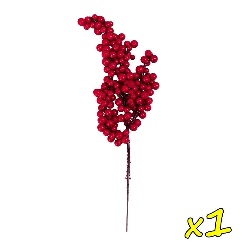A single stem of artificial red holly berries used for Christmas decor.