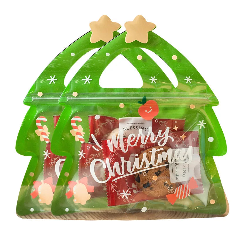 A green reusable gift bag filled with Christmas treats and party favors