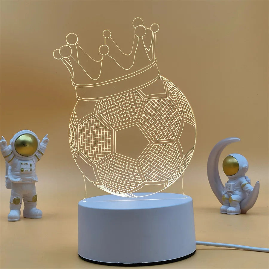 A glowing wireframe football crown night light displayed on a white base with a small astronaut figure.