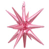 A cluster of pink star burst foil balloons used for party decor.