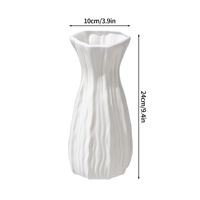 Modern white plastic decorative vase with vertical ribbed texture.