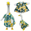 A set of goose costumes featuring a white body and green tropical leaf patterned fabric for summer lawn decor.