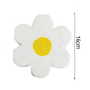 A white disposable flower napkin with a yellow center and a measurement line indicating 16cm height.