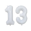 Two clear foil number balloons shaped like the numbers 1 and 3
