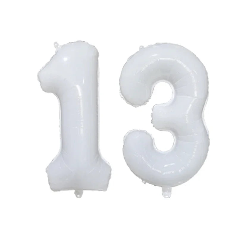 Two clear foil number balloons shaped like the numbers 1 and 3