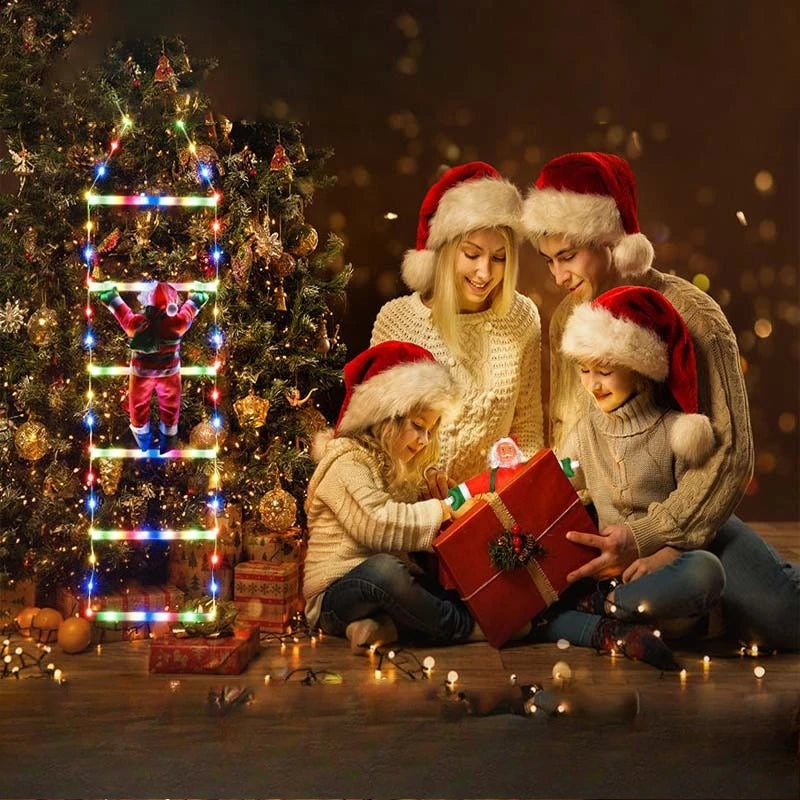 Four children in festive sweaters and Santa hats are gathered around a glowing Christmas tree decorated with LED lights.