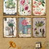 A collection of vintage metal signs featuring floral designs and botanical illustrations.