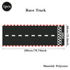 A black race track marked with a starting line and checkered finish line, made of polyester.