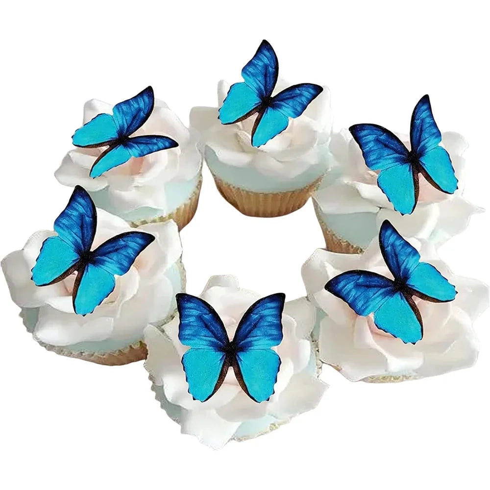 A set of four pink butterfly cupcake toppers with blue wings arranged in a circle.