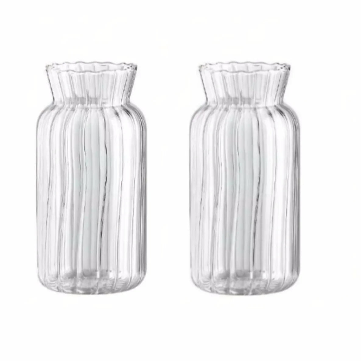 A pair of clear glass vases with vertical stripes for home decor.