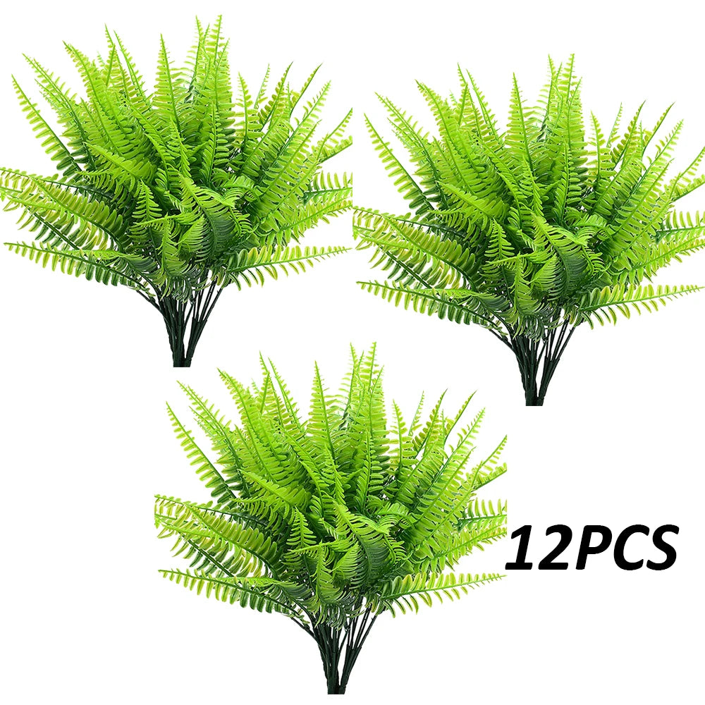 A bundle of twelve artificial green Boston ferns and faux shrubs for home decor