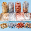 Various colors of shiny gold foil flakes for resin art and jewelry making displayed in glass jars and plastic bags.