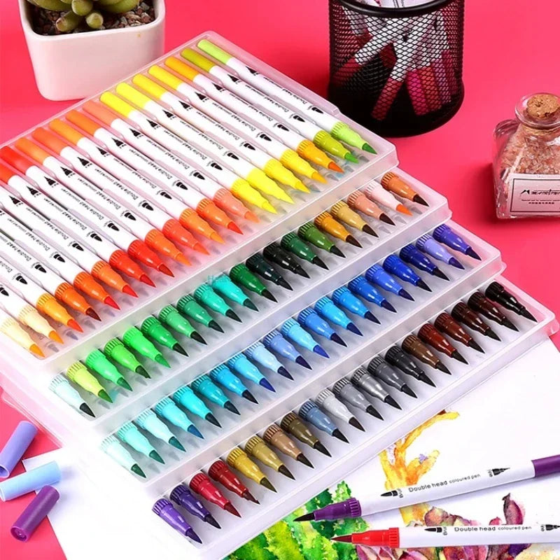 A collection of dual-ended watercolor art markers in various colors arranged neatly in a white plastic case.