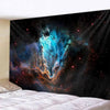 A dark fabric tapestry depicting a vibrant blue and orange nebula in space with scattered stars.