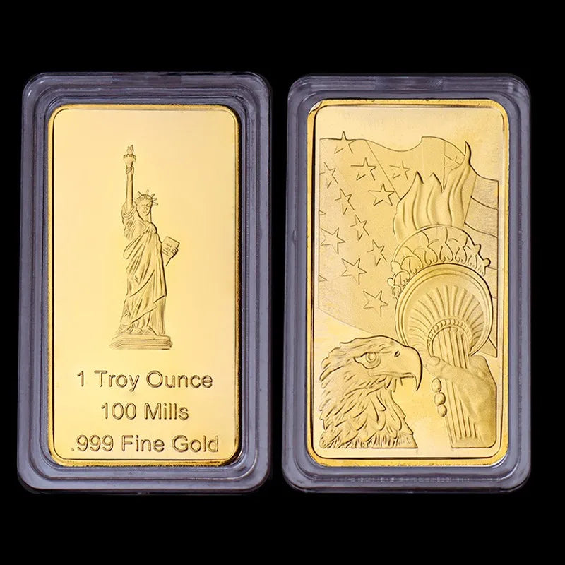 Two gold bullion ingots, one featuring a statue of David and the other an eagle, both marked as 1 Troy Ounce, 100 Mills, and 