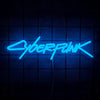 A glowing blue neon sign spelling out CYBERPUNK suspended against a dark grid background.