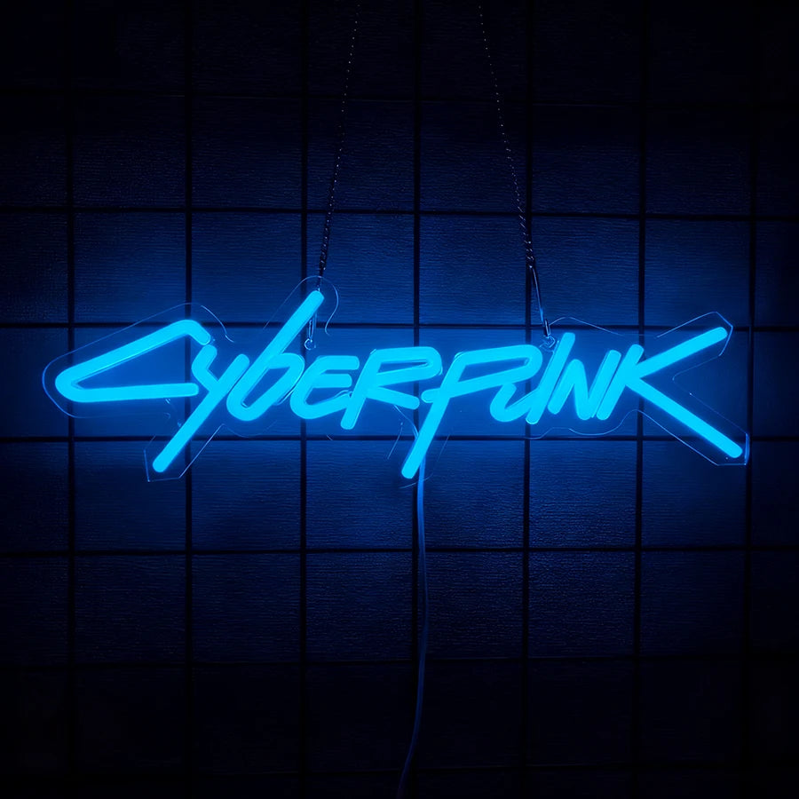 A glowing blue neon sign spelling out CYBERPUNK suspended against a dark grid background.
