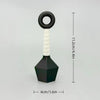 A black and white ornament shaped like a dart with a ring handle.