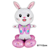A cute cartoon white bunny foil balloon with pink ears and a purple outfit.