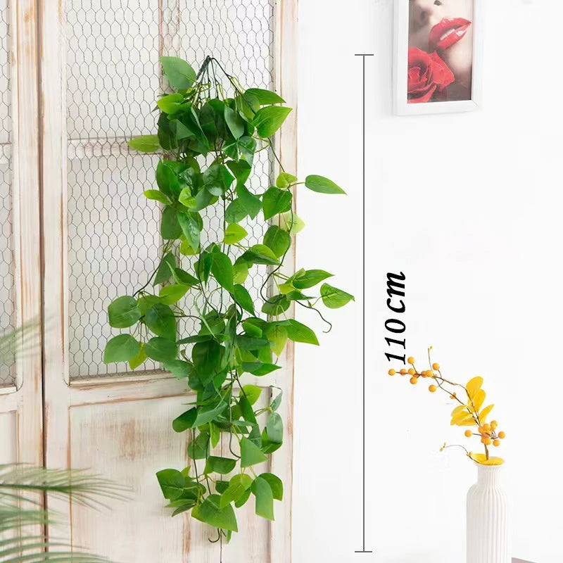 Artificial plant vines wall hanging with green leaves displayed on a white door