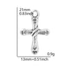 A silver cross charm measuring 21mm long and weighing 0.9g.