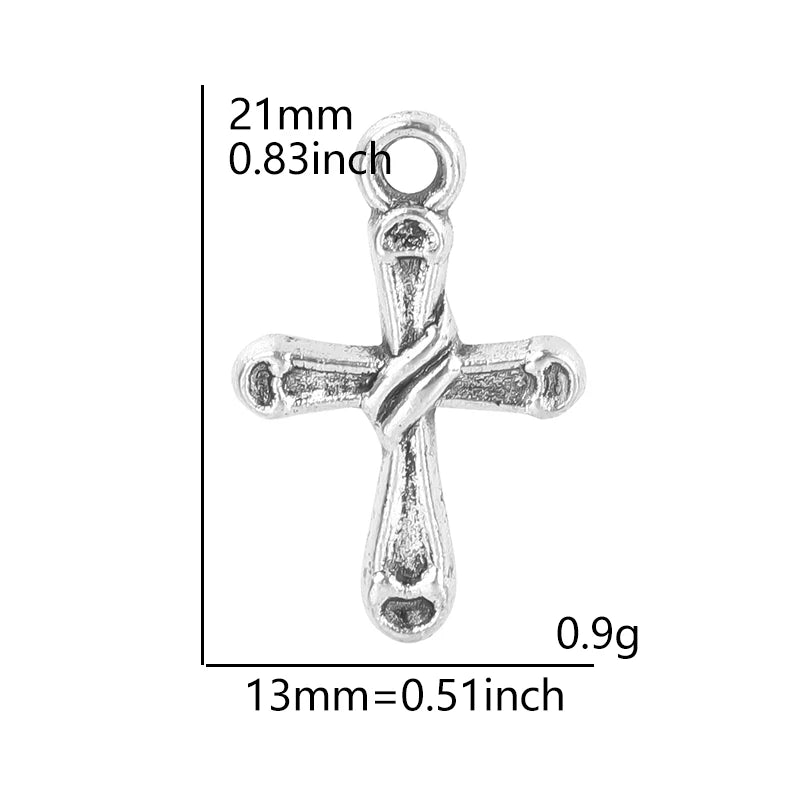 A silver cross charm measuring 21mm long and weighing 0.9g.