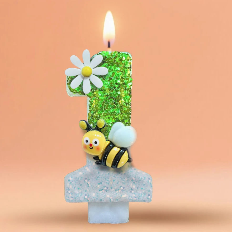 A birthday candle shaped like the number one, decorated with a daisy and a bee, set in a light blue holder.
