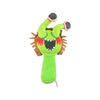 A bright green plush toy resembling a monster with large eyes and sharp teeth.