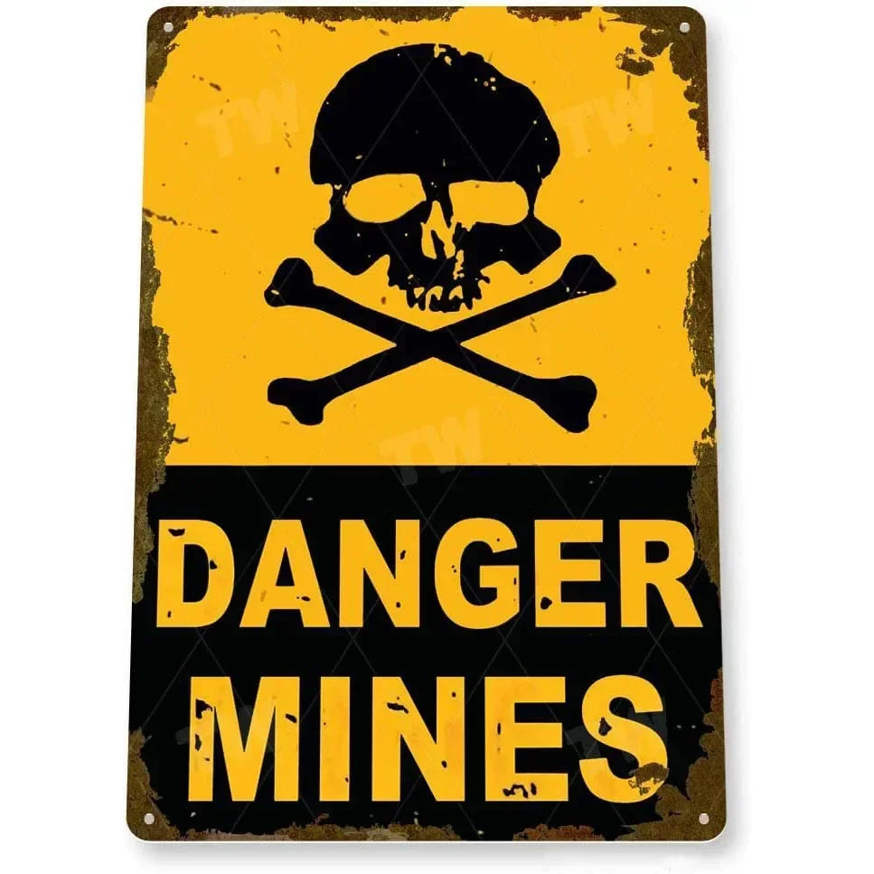 Vintage yellow and black tin sign featuring a skull and crossbones symbol and the text DANGER MINES.