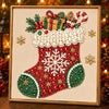 A framed diamond painting featuring a red and green Santa boot decorated with pearls, gems, and Christmas greenery.