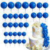 A set of blue foam cake toppers on sticks, including various shapes and sizes.