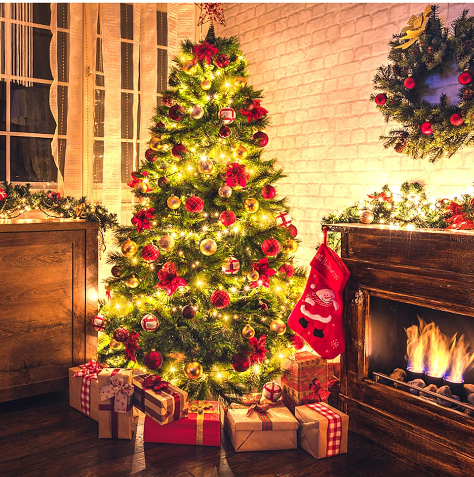 A decorated Christmas tree lit with warm LED string lights and surrounded by festive holiday decor.