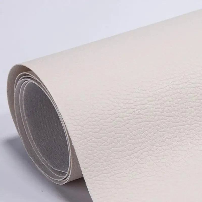 Roll of beige self-adhesive PU leather repair patches shown from the side.