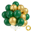 A cluster of chrome gold and dark green balloons tied together with gold strings.