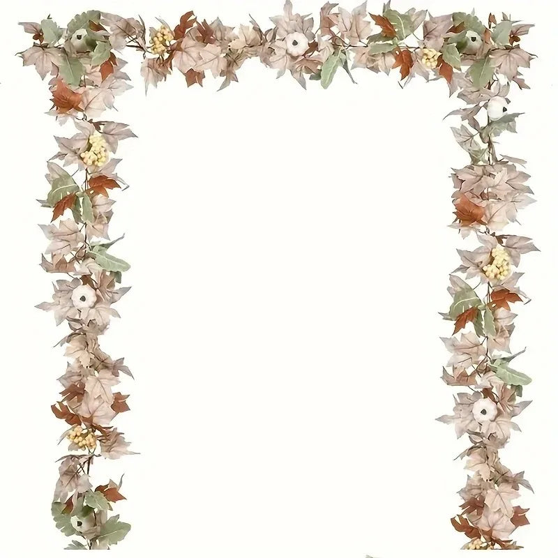 A long garland of artificial maple leaves and small flowers in muted autumn tones for decor.