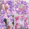 A collection of pink and purple balloons forming an arch or garland for decoration.