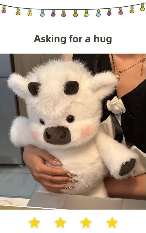 A white West Highland Calf plush toy is being held by a person.