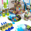 A set of Minecraft-themed party supplies including flag pulling cake toppers and tableware