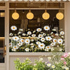 White daisy flower static cling window decals displayed in a glass storefront window.