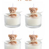 Four soy wax teddy bear candles in glass jars with ribbon