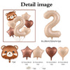 A set of caramel-colored foil balloons shaped like the number 2 and various heart shapes, including a bear-themed balloon.