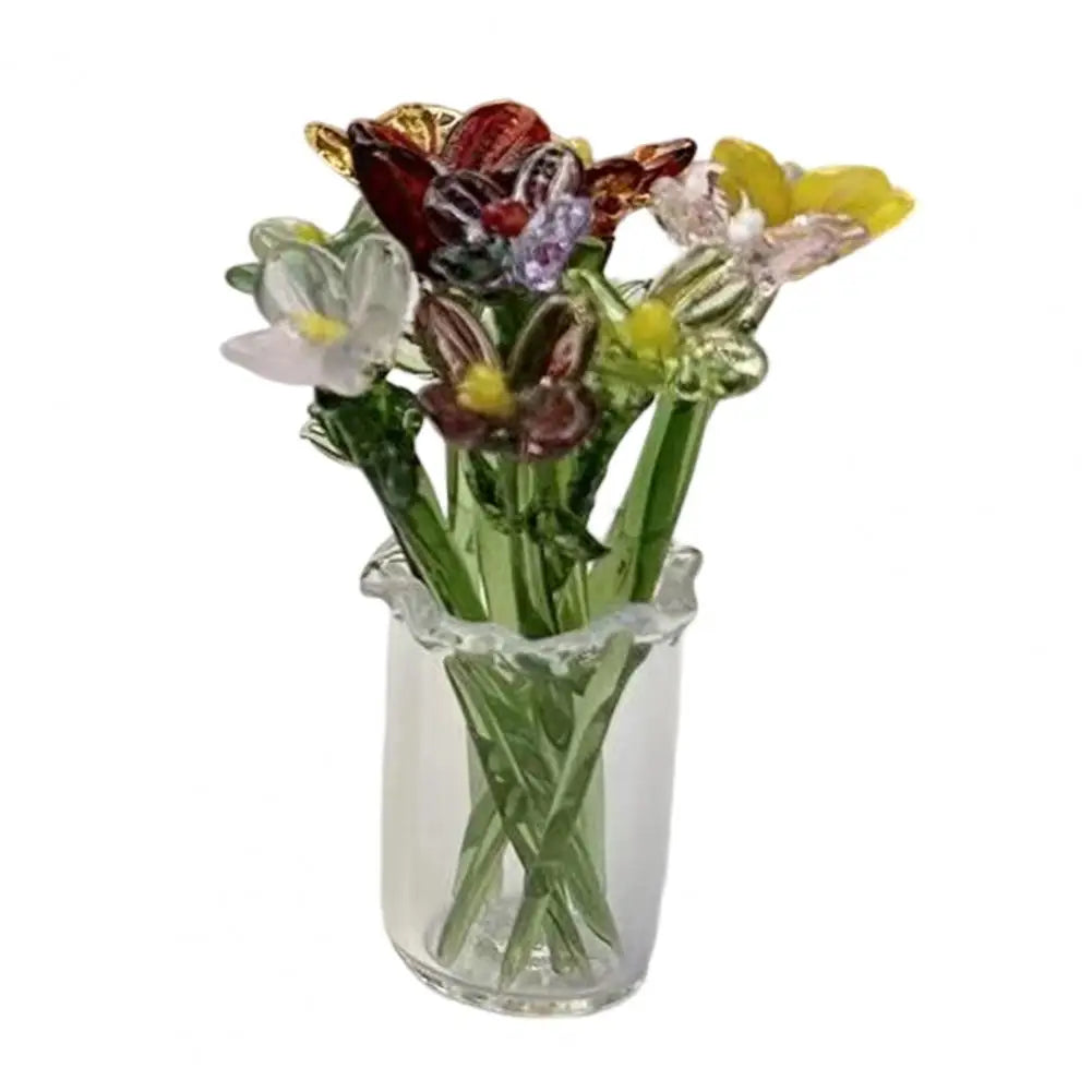 Hand-blown glass flower bouquet featuring various colored blooms in a clear mini vase