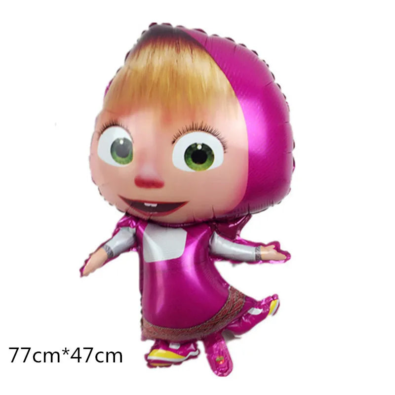 A plush decoration of a girl with blonde hair wearing a pink outfit and a pink hood.
