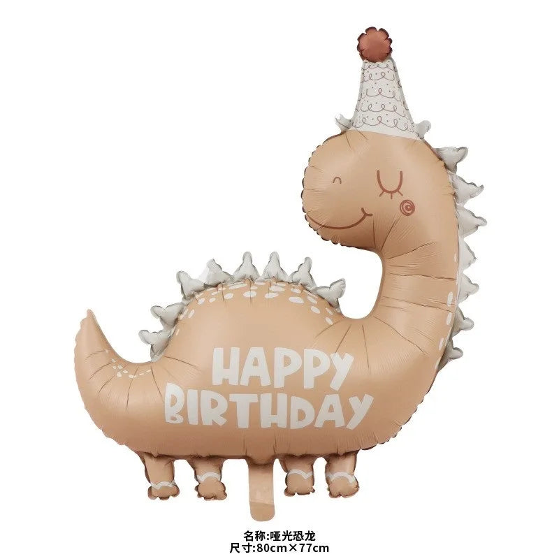 A light brown dinosaur-shaped balloon with a horn and the text HAPPY BIRTHDAY printed on it.