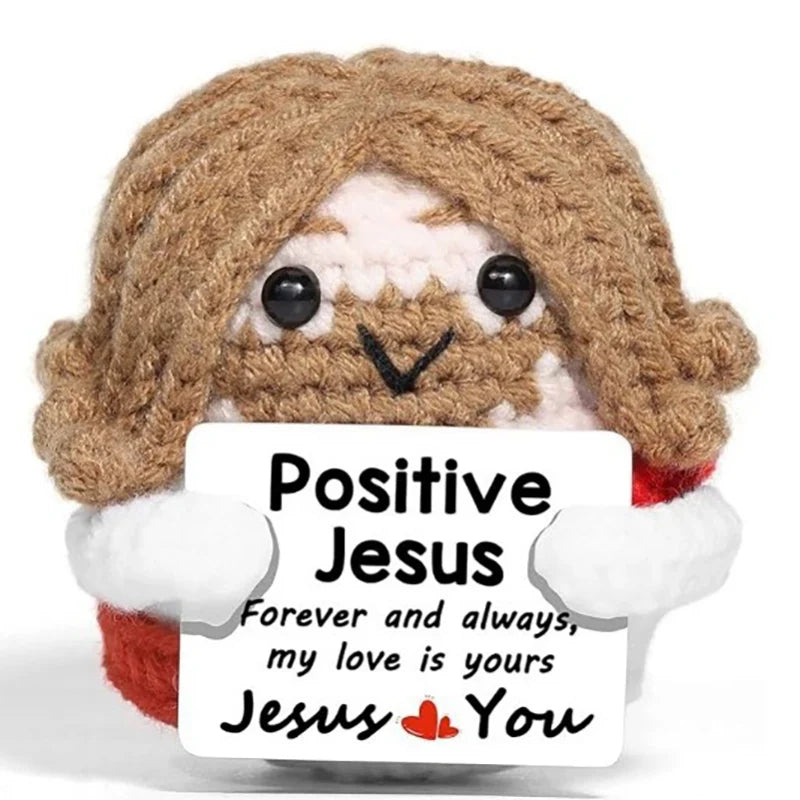 Handmade crochet potato doll with brown hair and white fur holding an inspirational card that says Positive Jesus Forever and