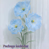 Blue silk poppy flower heads, stems, and base displayed against a white background.