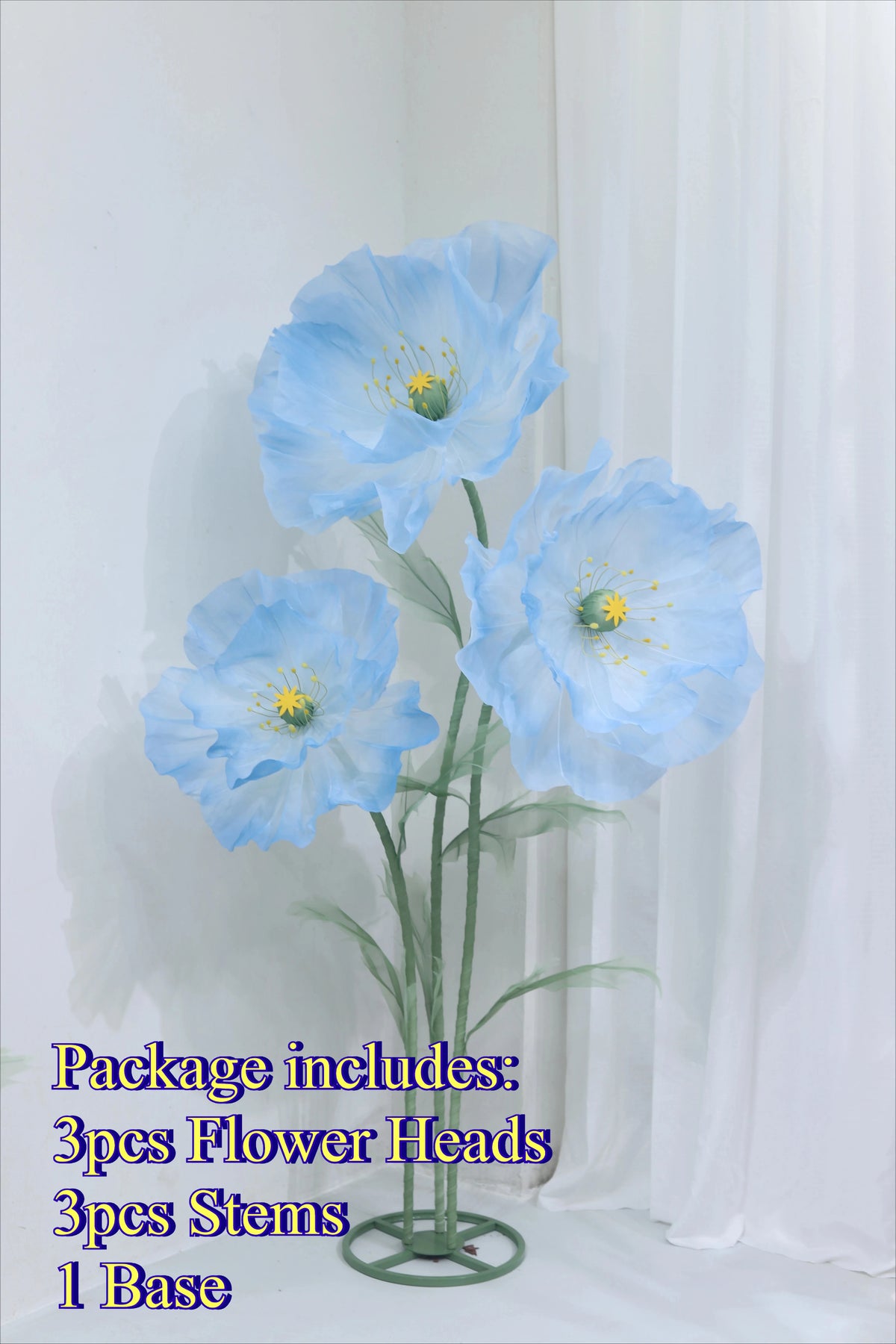 Blue silk poppy flower heads, stems, and base displayed against a white background.