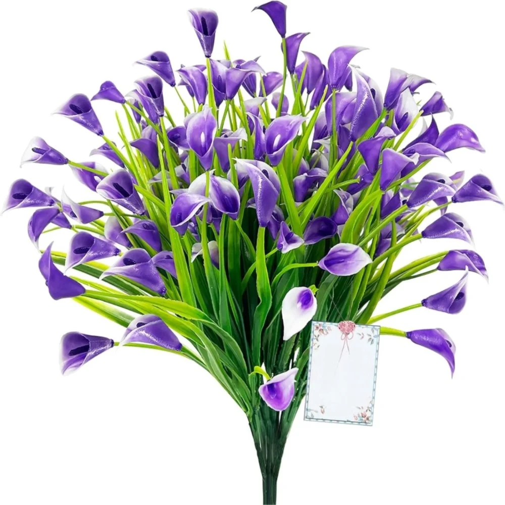 A bouquet of purple artificial calla lilies with green stems and a white card